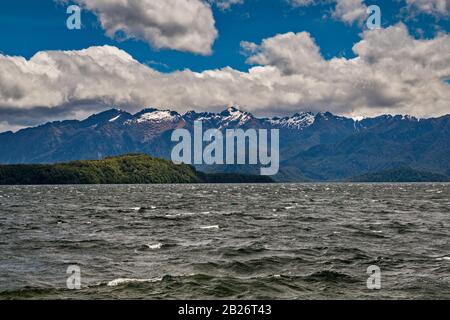Lake Manapouri, Kepler Mountains in distance, Southern Alps, Fiordland National Park, town of Manapouri, Southland Region, South Island, New Zealand Stock Photo