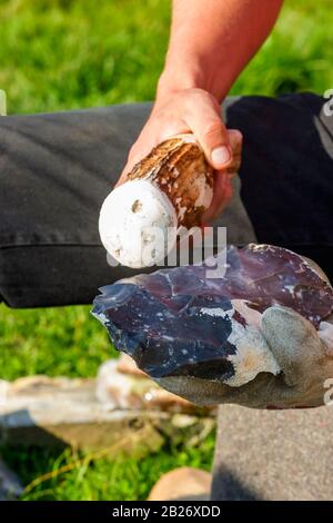 Manufacture of a flintax with a horn club Stock Photo
