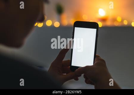 Woman pointing on smartphone screen, chatting in social networks, meeting website, searching internet, sending sms, using text messenger or online Stock Photo