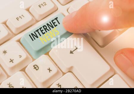 Writing note showing Internet News. Business concept for the information about current events published online Stock Photo