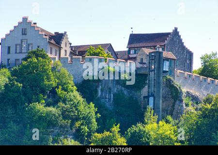 the famous rhine falls in the swiss near the city of Schaffhausen - sunny day and blue sky ´tower on the top of the canyon Stock Photo