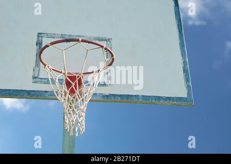 Basketball basket. Backboard basket on cloudy blue sky background. Stock Photo