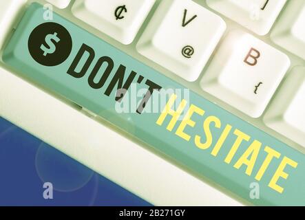 Conceptual hand writing showing Don T Hesitate. Concept meaning do something and do not have to worry about the outcome Stock Photo