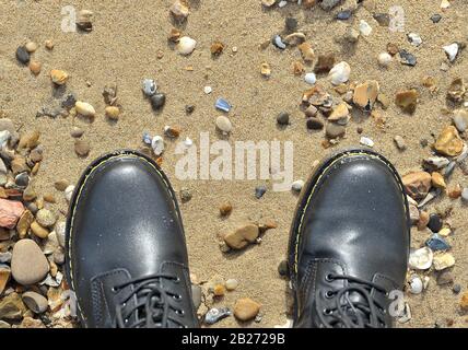 Southend. United Kingdom. 19 February 2020. Doctor Martin boots on the beach. On the beach at Shoeburyness. Southend. Essex. UK. 19/02/2020.  MANDATORY Credit Victoria Bowden/Sport In Pictures/Alamy Live News Stock Photo