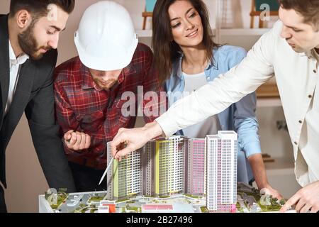 young architects discuss with female head engineer construction project.close up cropped photo. interesting meeting with designers Stock Photo