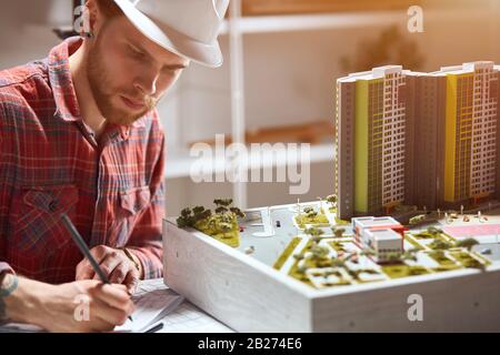 talented young architect sketching a construction project. close up photo. Stock Photo