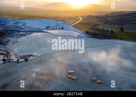 Pamukkale travertine terraces at sunset time. Stock Photo