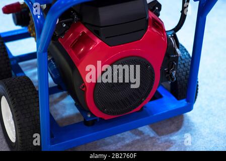 Gasoline Portable Generator on the House Construction Site. Close up on Mobile Backup Generator .Standby Generator - Outdoor Power Equipment. Stock Photo