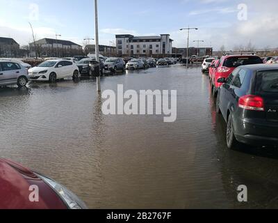 Glasgow, UK. 1st Mar, 2020. Roads and car parks struggle to cope with amount of rainfall in recent days in Scotland. Car park in Breahead Soar shopping and entertainment centre flooded following a heavy rain, Glasgow, UK Credit: Alamy News/Pawel Pietraszewski Credit: Pawel Pietraszewski/Alamy Live News Stock Photo