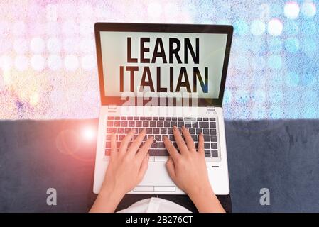 Conceptual hand writing showing Learn Italian. Concept meaning gain or acquire knowledge of speaking and writing Italian Stock Photo