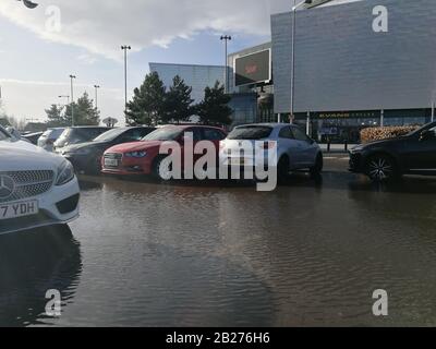 Glasgow, UK. 1st Mar, 2020. Roads and car parks struggle to cope with amount of rainfall in recent days in Scotland. Car park in Breahead Soar shopping and entertainment centre flooded following a heavy rain, Glasgow, UK Credit: Alamy News/Pawel Pietraszewski Credit: Pawel Pietraszewski/Alamy Live News Stock Photo