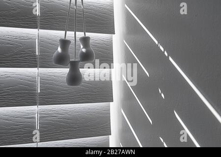Plastic tassels on lift cord with early morning light Stock Photo