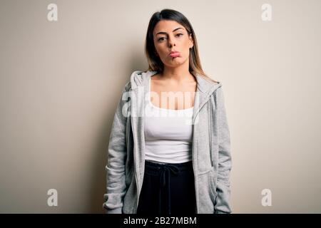 Middle age beautiful sportswoman wearing sportswear sitting on mat  practicing yoga at home with sad expression covering face with hands while  crying Stock Photo - Alamy