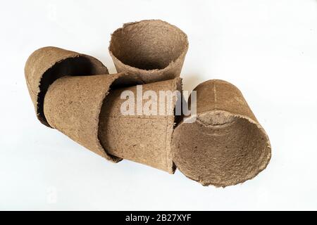The Peat containers for seedings on white background. Insulated subject for seedling Stock Photo