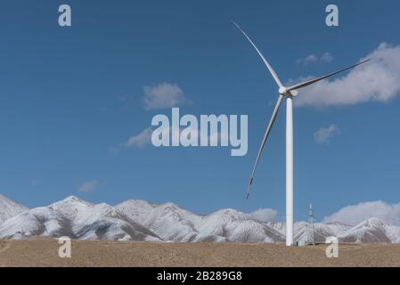 the wind power plant on dry grassland Stock Photo
