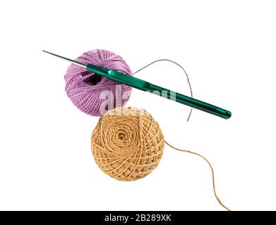 Ball of wool yarn and crochet hook isolated on white background. Stock Photo