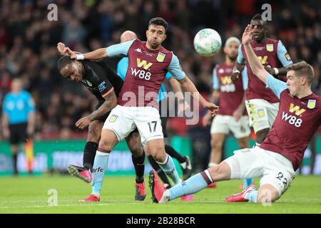 London, UK. 1st March 2020.  Raheem Sterling (7) of Manchester City battles with Mahmoud Trezeguet (17) of Aston Villa during the Carabao Cup Final between Aston Villa and Manchester City at Wembley Stadium, London on Sunday 1st March 2020. (Credit: Jon Bromley | MI News) Photograph may only be used for newspaper and/or magazine editorial purposes, license required for commercial use Credit: MI News & Sport /Alamy Live News Stock Photo