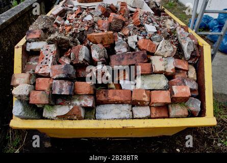 Builder's skip full of bricks Stock Photo