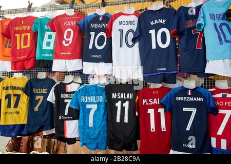 fake famous soccer player shirts for sale on clothes stall at playa blanca market in the marina rubicon Lanzarote canary islands spain Stock Photo