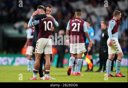Aston Villa's Jack Grealish is consoled by assistant manager John Terry during the Carabao Cup Final at Wembley Stadium, London. Stock Photo