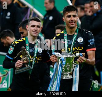 London, UK. 1st Mar 2020. L-R Manchester City's Phil Foden with Men of the Match award with Manchester City's Rodrigo with Trophy Carabao Cup Final between Aston Villa and Manchester City at Wembley Stadium, London, England on 01 March 2020 Credit: Action Foto Sport/Alamy Live News Stock Photo