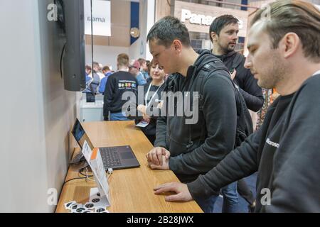 KYIV, UKRAINE - APRIL 06, 2019: People visit Microsoft, American multinational technology company booth at CEE 2019, the largest electronics trade sho Stock Photo