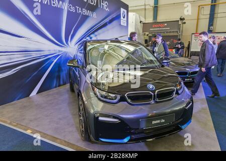 KYIV, UKRAINE - APRIL 06, 2019: People visitb BMW electric cars booth during CEE 2019, the largest electronics trade show of Ukraine in Tetra Pack EC. Stock Photo