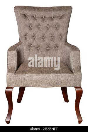 A wooden soft armchair upholstered in brown textile upholstery with bent curly legs, photographed frontally, isolated on a white background. Stock Photo