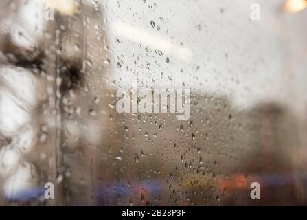 Rain drops on the window of a UK train Stock Photo