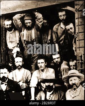 A rare documentary photo from the Boer War showing British POW arriving in Pretoria -  This group were the first British POW's to be captured  - The three men standing at the front are guards. The photograph was featured on a collectable cigarette card Stock Photo