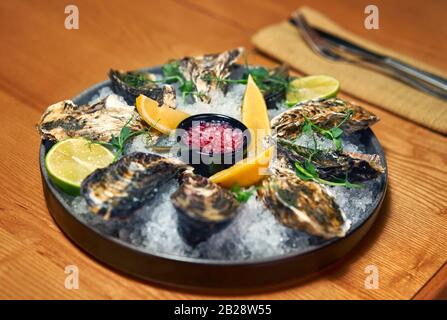 man eating oysters at the table Stock Photo