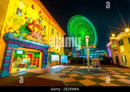Yokohama, Japan - April 21, 2017: Cosmo World amusement park in Minato Mirai 21 district with Cosmo Clock 21, a Ferris wheel. The park is divided in Stock Photo