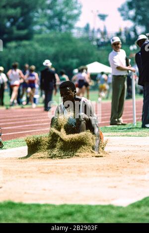 Carl Lewis competing the long jump at the 1984 US Pepsi Invitational. Stock Photo