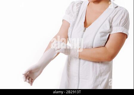 Coronavirus. 2019-nCoV. Woman doctor hands wears medical latex blue gloves to help protect herself from the Coronavirus. Stock Photo