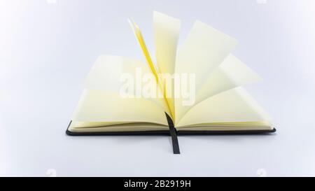 Open book on white background, top view. Space for text. Close up. Stock Photo