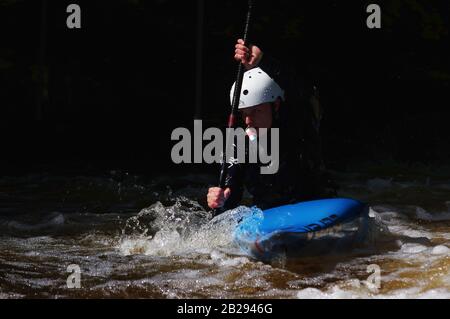 Whitewater playboater June 2019 Stock Photo