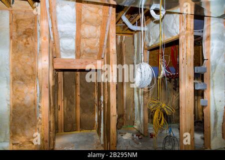 Basement unfinished under construction residential home framing stick built frame Stock Photo