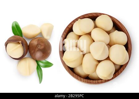 macadamia nuts in wooden bowl isolated on white background with clipping path and full depth of field. Top view. Flat lay. Stock Photo