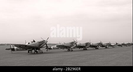 Fighter aircraft from the Battle of Britain lined up fuelled and ready for flight. Stock Photo