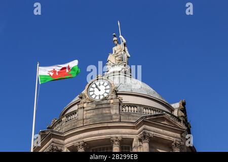 Wales national flag flying at Liverpool Town Hall for Saint David's Day, High Street, Liverpool. Stock Photo