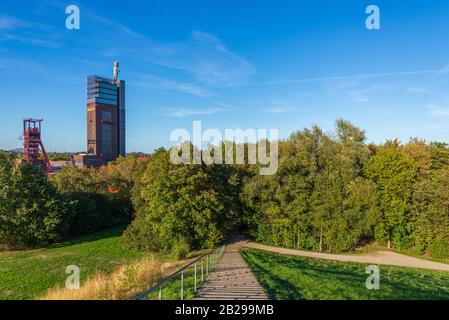 Scenery of Nordstern park, former coal mine area, from small hill and background of Nordsternturm and  Zeche Nordstern. Stock Photo