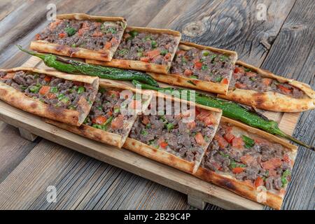 Traditional Turkish dish pita beef - Kusbasili Pide. Turkish Pide with Cube. takeaway concept Stock Photo