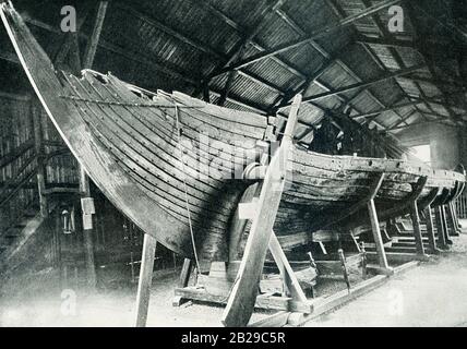 The Gokstad ship was built around 890 AD, at the height of the Viking period. It was a fast and flexible ship that was suitable for voyages on the high seas. A large burial mound called ‘the king’s mound’ was situated at the farm of Gokstad in Sandefjord municipality of Norway. In autumn 1879 the two teenage sons on the farm were bored and started to dig into the mound. A ship was said to lie in the burial mound, and it was this that the boys found. Stock Photo