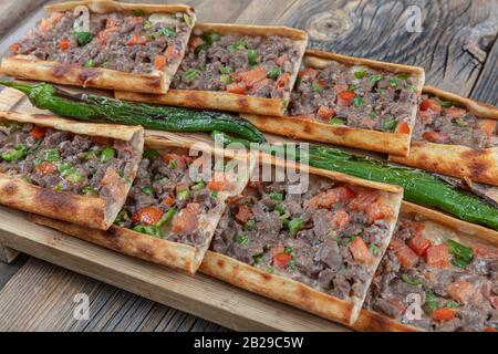 Traditional Turkish dish pita beef - Kusbasili Pide. Turkish Pide with Cube. takeaway concept Stock Photo