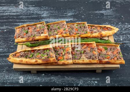 Traditional Turkish dish pita beef - Kusbasili Pide. Turkish Pide with Cube. takeaway concept Stock Photo