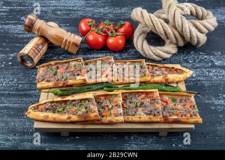 Traditional Turkish dish pita beef - Kusbasili Pide. Turkish Pide with Cube. takeaway concept Stock Photo