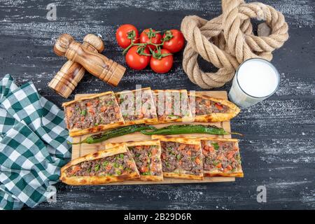 Traditional Turkish dish pita beef - Kusbasili Pide. Turkish Pide with Cube. takeaway concept Stock Photo
