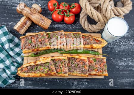 Traditional Turkish dish pita beef - Kusbasili Pide. Turkish Pide with Cube. takeaway concept Stock Photo