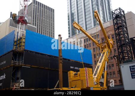 Cranes on construction site in downtown Stock Photo