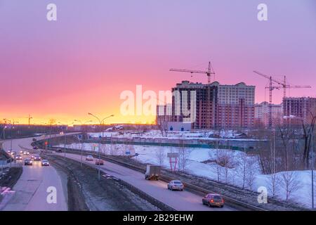 Kemerovo, Russia - march 2019, bypass with road signs - Stroiteley Boulevard, Oktyabrsky Avenue, Rudnichny District. and construction of multi-storey Stock Photo
